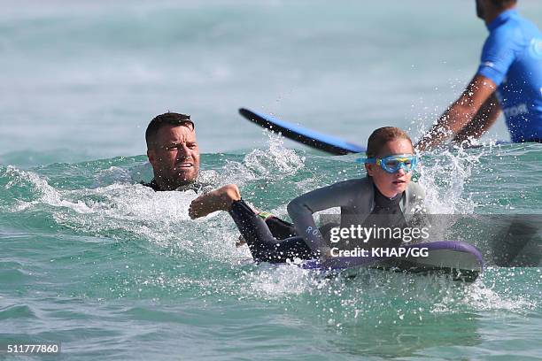 Paleo advocate and celebrity chef, Pete Evans enjoys surfing at Bondi Beach with his daugters Chilli and Indii on February 22, 2016 in Sydney,...