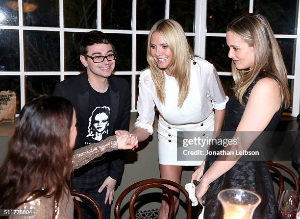 Actress Juliette Lewis, fashion designer Christian Siriano, model Heidi Klum, and actress Alicia Silverstone attend a dinner for the launch of the...