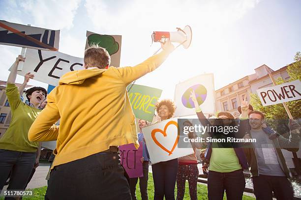 group of young people demonstrating with banners - march 22 2013 stock pictures, royalty-free photos & images
