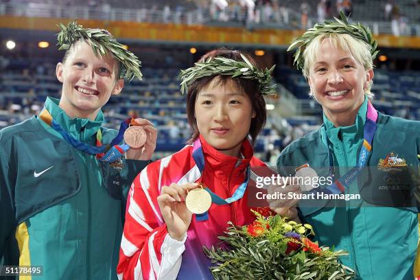 Gold medalist Xuejuan Luo of China , Silver medalist Brooke Hanson of Australia and Bonze medalist Leisel Jones of Australia pose with their medals...