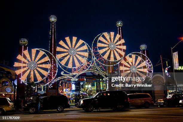 neon lights of coney island amusement park - luna park coney island stock-fotos und bilder