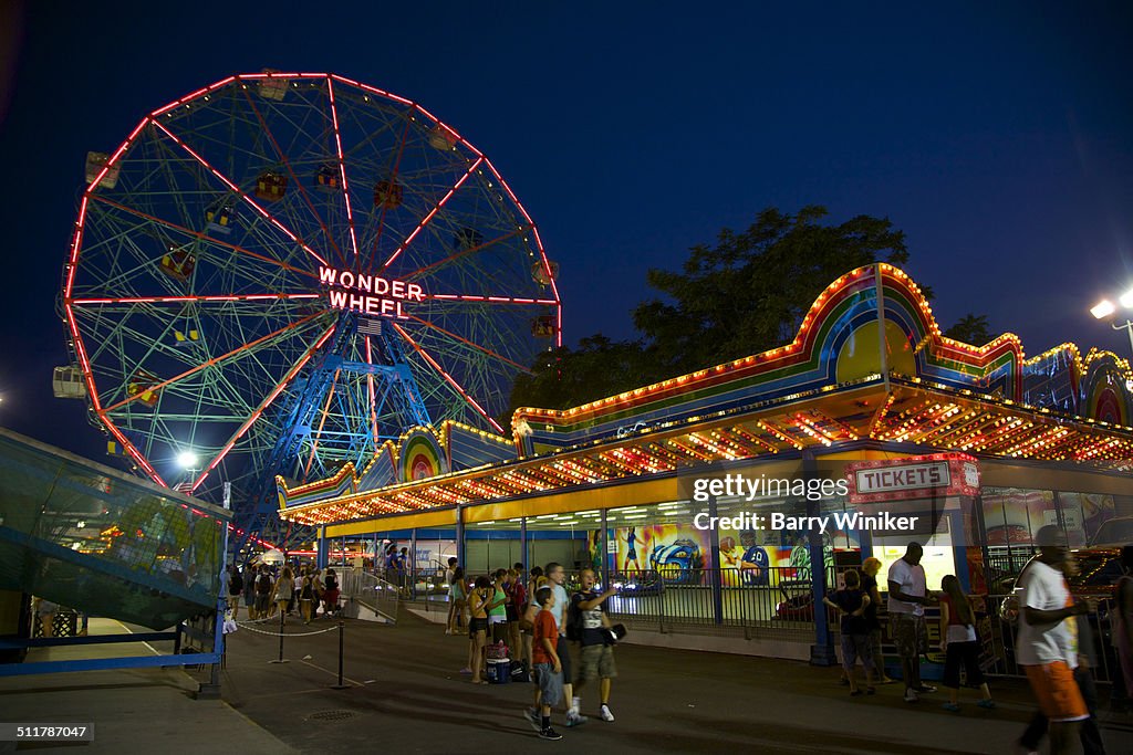 Two Coney Island amusements at dusk