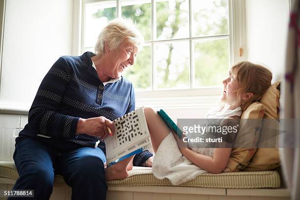 fun at grandma's house - senior puzzle stock pictures, royalty-free photos & images