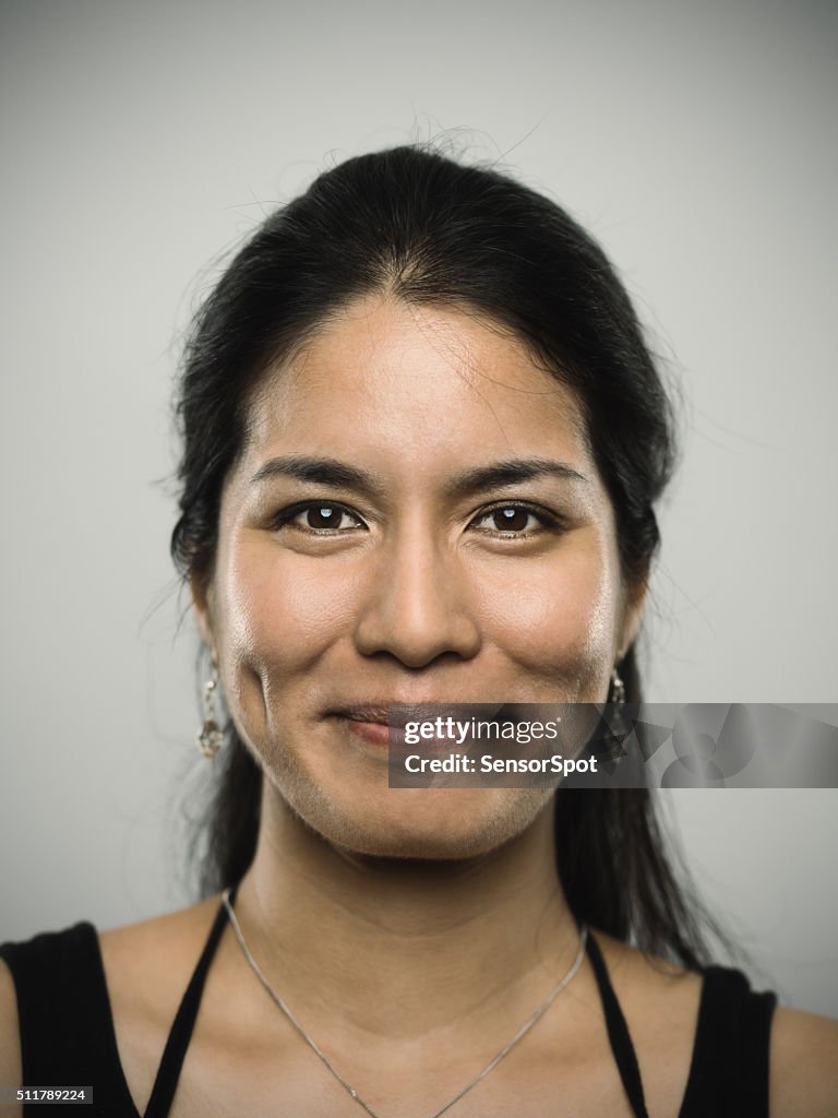 Portrait of a young mixed race woman looking at camera