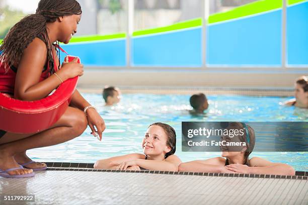 learning to swim from a lifeguard - the lifeguard stock pictures, royalty-free photos & images