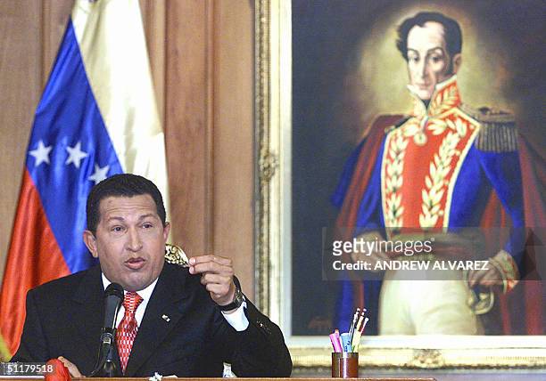 Venezuelan President Hugo Chavez answers a question during his first press conference after winning the recall referendum 16 August 2004 at the...