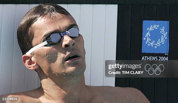 Alexander Popov from Russia reacts at the end of the men's 100m freestyle, heat 9, at the 2004 Olympic Games at the Olympic Aquatic Center in Athens,...