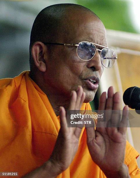 Buddhist monk Ellawela Medananda speaks at a meeting at a suburb of the Sri Lankan capital Colombo 17 August 2004 at the start of a meeting against...