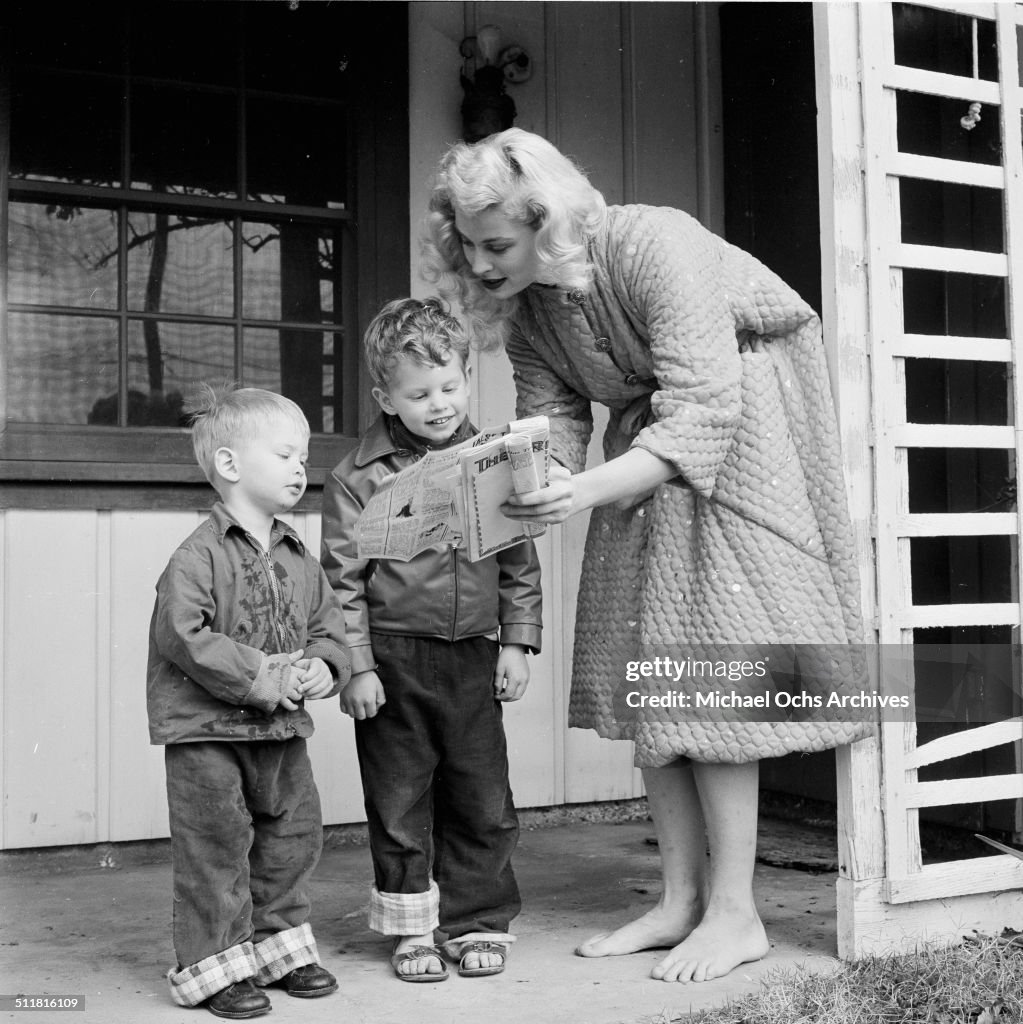Actress Irish McCalla poses at home with kids Kim McIntyre and Sean ...