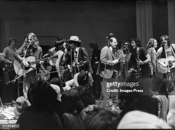Members of the Rolling Thunder Revue including Joan Baez, Bob Dylan, Allen Ginsberg and Roberta Flack perform a benefit concert for Rubin Hurricane...