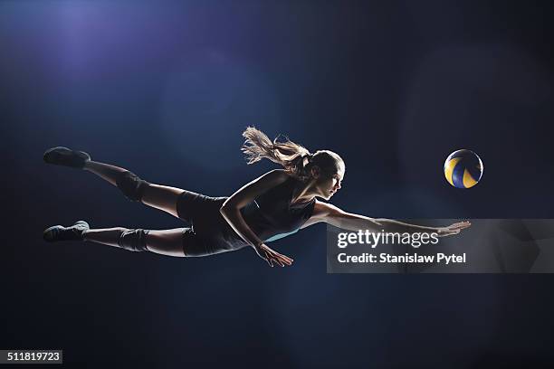 volleyball player jumping to the ball - volleyball sport stock pictures, royalty-free photos & images