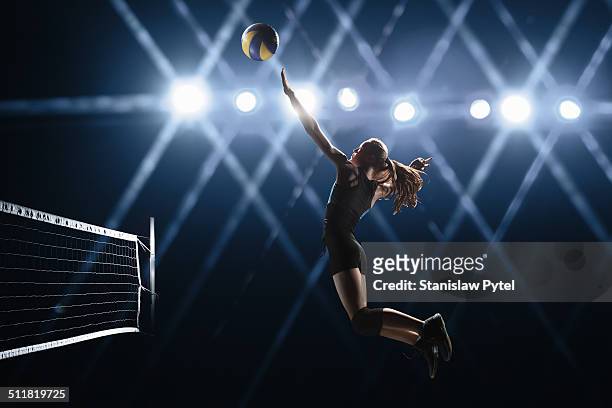 volleyball player jumping to the ball - candid volleyball stock pictures, royalty-free photos & images