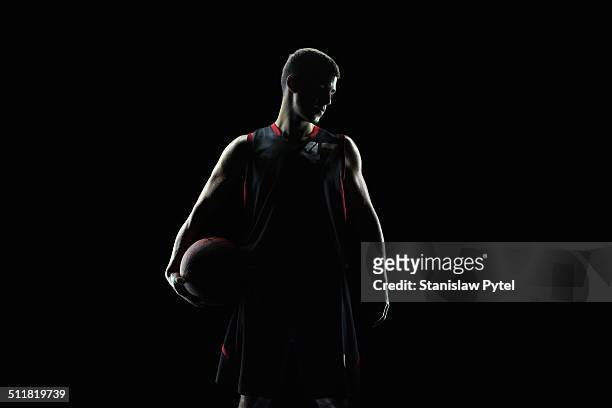 portrait of basketball player, in profile - basketballspieler stock-fotos und bilder