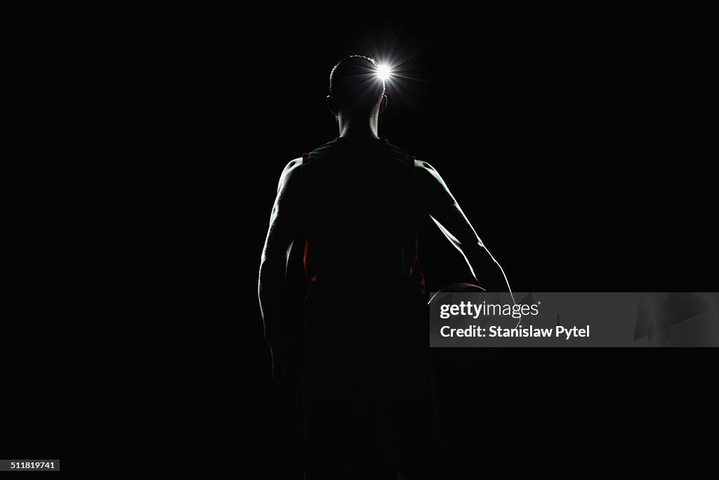 Portrait of basketball player facing lights