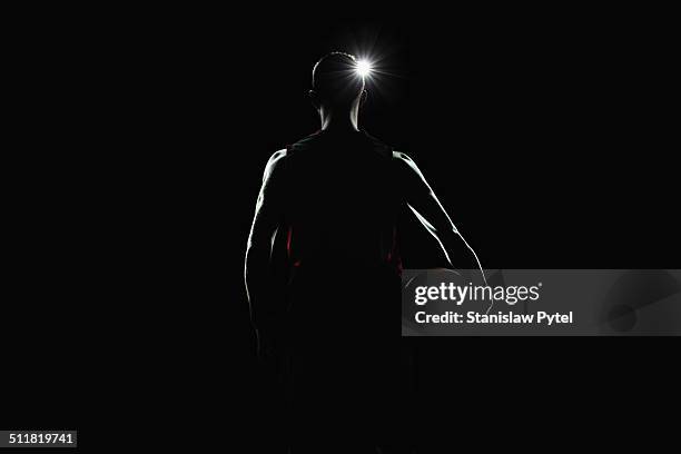 portrait of basketball player facing lights - backlight stock pictures, royalty-free photos & images