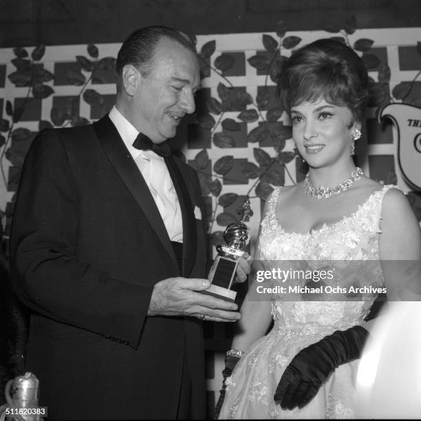 Gina Lollobrigida receives a Golden Globe Award for "Come September" during the Golden Globe Awards in Los Angeles,CA.\