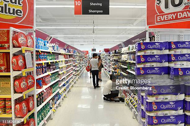 Customers walk through an aisle in a Coles supermarket, operated by Wesfarmers Ltd., in Melbourne, Australia, on Tuesday, Feb. 23, 2016. Wesfarmers,...
