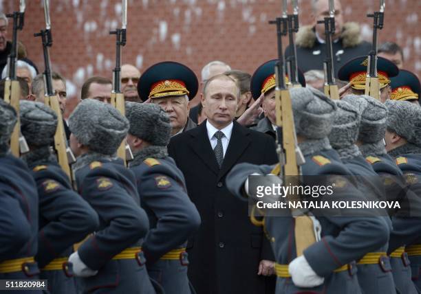 Russian President Vladimir Putin attends a wreath laying ceremony at the Tomb of the Unknown Soldier by the Kremlin wall to mark the Defender of the...