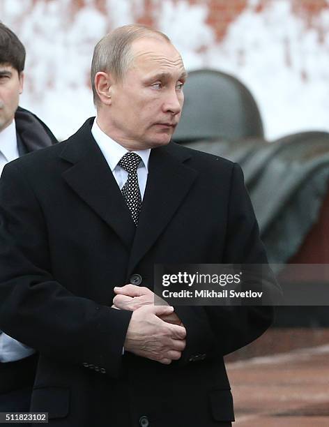 Russian President Vladimir Putin attends a wreath laying ceremony at the Unknown Soldier Tomb in front of the Kremlin on February 23, 2016 in Moscow,...