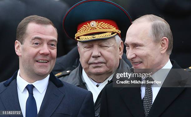 Russian President Vladimir Putin and Prime Minister Dmitry Medvedev during a wreath laying ceremony at the Unknown Soldier Tomb in front of the...