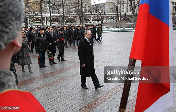 Russian President Vladimir Putin attends a wreath laying ceremony at the Unknown Soldier Tomb in front of the Kremlin on February 23, 2016 in Moscow,...