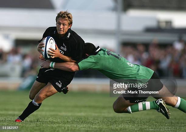 Jonny Wilkinson of Newcastle is tackled by James Downey of Connacht during the pre-season friendly match between Connacht and Newcastle Falcons at...
