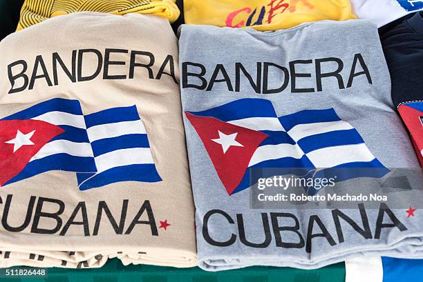 Flag of Cuba on two shirts along with Bandera Cubana which means flag of Cuba in their language. This symbol is shown in two shirts as symbol of...