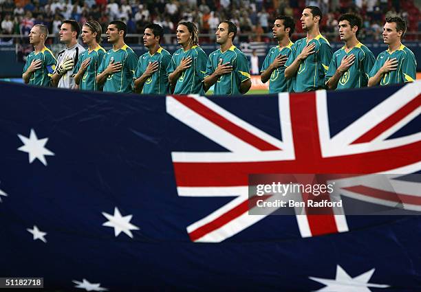 The Australian Team sing the national anthem before their men's football preliminary match against Argentina on August 17, 2004 during the Athens...