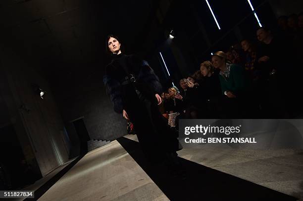 Model presents a creation by British designer Amanda Wakeley during her catwalk show at the Autumn / Winter 2016 London Fashion Week in London on...