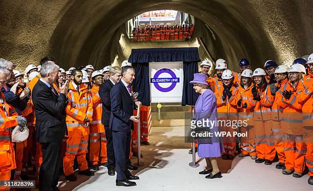 Queen Elizabeth unveils the new roundel for the Crossrail line next toTerry Morgan, Chairman of Crossrail and London's mayor Boris Johnson during a...