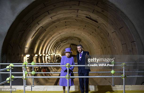Queen Elizabeth stands with Mike Brown, London transport commissioner at the tunnel entrance to one of the new platforms of the new Crossrail Bond...
