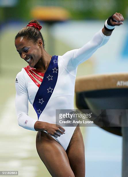 Annia Hatch of the United States celebrates after her vault attempt at the women's artistic gymnastics team final competition on August 17, 2004...