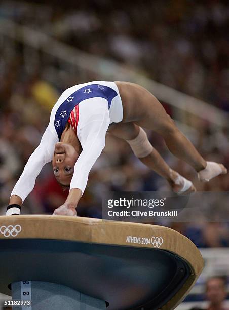 Annia Hatch of the United States competes in the vault at the women's artistic gymnastics team final uneven on August 17, 2004 during the Athens 2004...