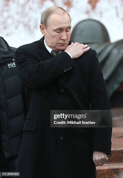 Russian President Vladimir Putin attends a wreath laying ceremony at the Unknown Soldier Tomb in front of the Kremlin on February 23, 2016 in Moscow,...