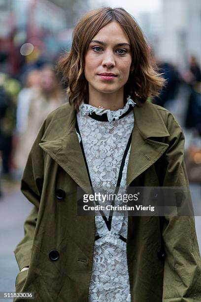 Alexa Chung wearing an olive trench coat seen outside Erdem during London Fashion Week Autumn/Winter 2016/17 on February 22, 2016 in London, England,...