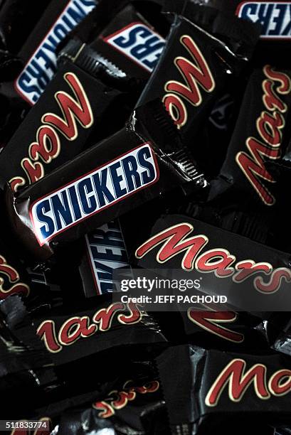 Mars and Snickers chocolate bars are pictured on February 23, 2016 in Lyon, central eastern France. Confectioner Mars said on February 23, 2016 it...