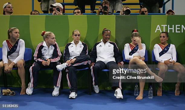 The USA team reacts to Romania winning the women's artistic gymnastics team final uneven on August 17, 2004 during the Athens 2004 Summer Olympic...