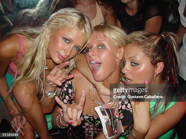 Socialites Paris Hilton, Nicky Hilton and Nicole Richie visit the Prive Nightclub in 2004 in Miami Beach, Florida.