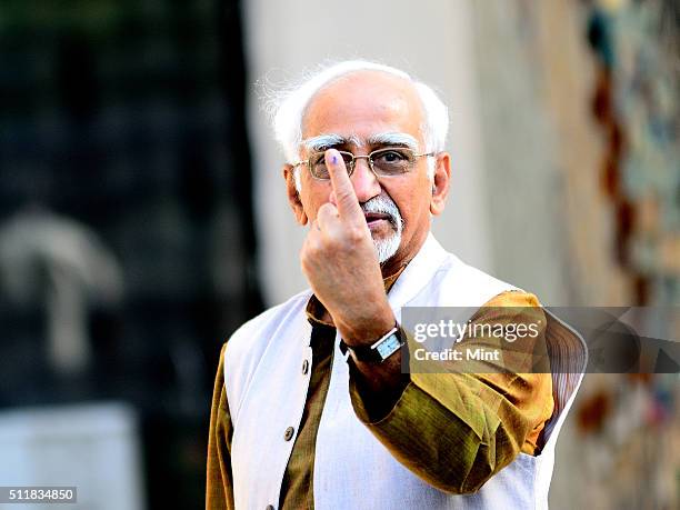 Vice President Hamid Ansari shows his ink-marked finger after casting his vote for general election of the 16th Lok Sabha 2014 on April 10, 2014 in...