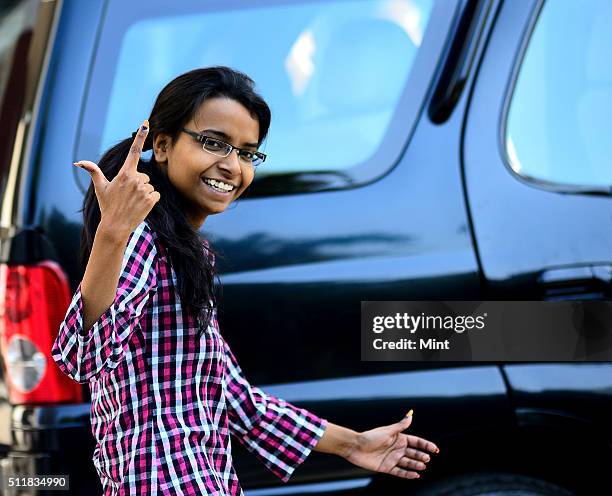 Girl showing the mark after casting her vote first time for general election of the 16th Lok Sabha 2014 on April 10, 2014 in New Delhi, India.