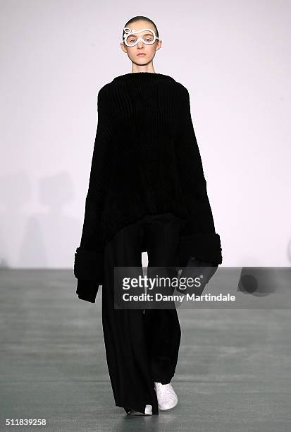Model walks the runway at the Xiao Li show during London Fashion Week Autumn/Winter 2016/17 at Brewer Street Car Park on February 23, 2016 in London,...