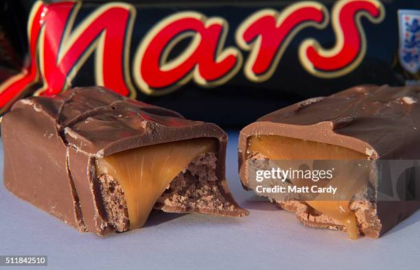 In this photo illustration a Mars chocolate bar is seen on February 23, 2016 in Bristol, England. The Mars company, which owns both brands, has...