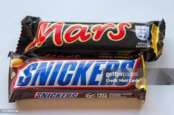 In this photo illustration Mars and Snickers chocolate bars are seen on February 23, 2016 in Bristol, England. The Mars company, which owns both...