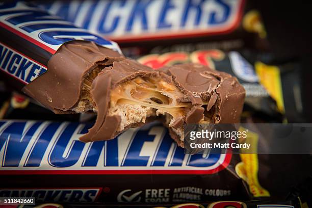 In this photo illustration Mars and Snickers chocolate bars are seen on February 23, 2016 in Bristol, England. The Mars company, which owns both...