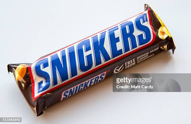 In this photo illustration a Snickers chocolate bar is seen on February 23, 2016 in Bristol, England. The Mars company, which owns both brands, has...