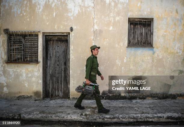 Member of the Cuban army gets ready to fumigate against the Aedes aegypti mosquito to prevent the spread of zika, chikungunya and dengue in a street...