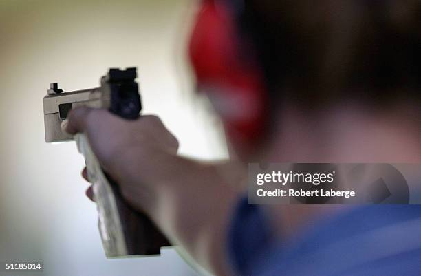 Rebecca Snyder of the USA lines up a shot during the women's 25 metre pistol qualifying event on August 18, 2004 during the Athens 2004 Summer...