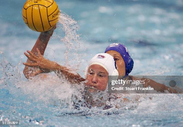 Kelly Rulon of USA in action against Jana Salat of Canada in the women's Water Polo preliminary game on August 18, 2004 during the Athens 2004 Summer...