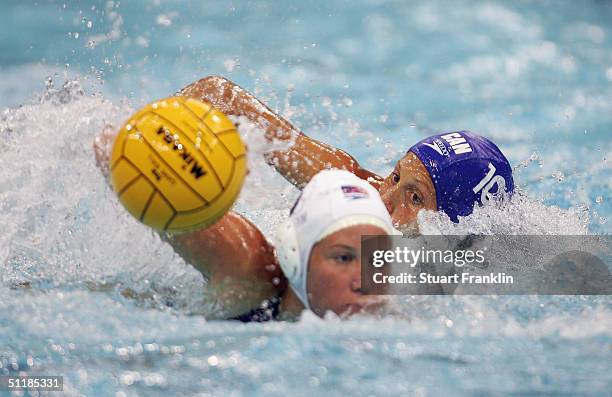 Kelly Rulon of USA in action against Jana Salat of Canada in the women's Water Polo preliminary game on August 18, 2004 during the Athens 2004 Summer...