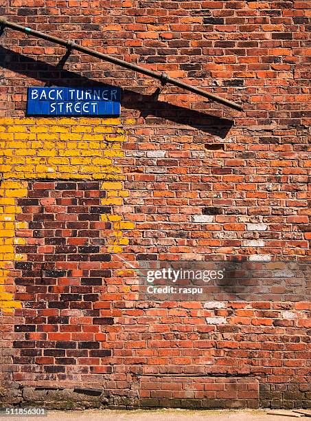 a brick wall in the northern quarter - northern quarter stock pictures, royalty-free photos & images